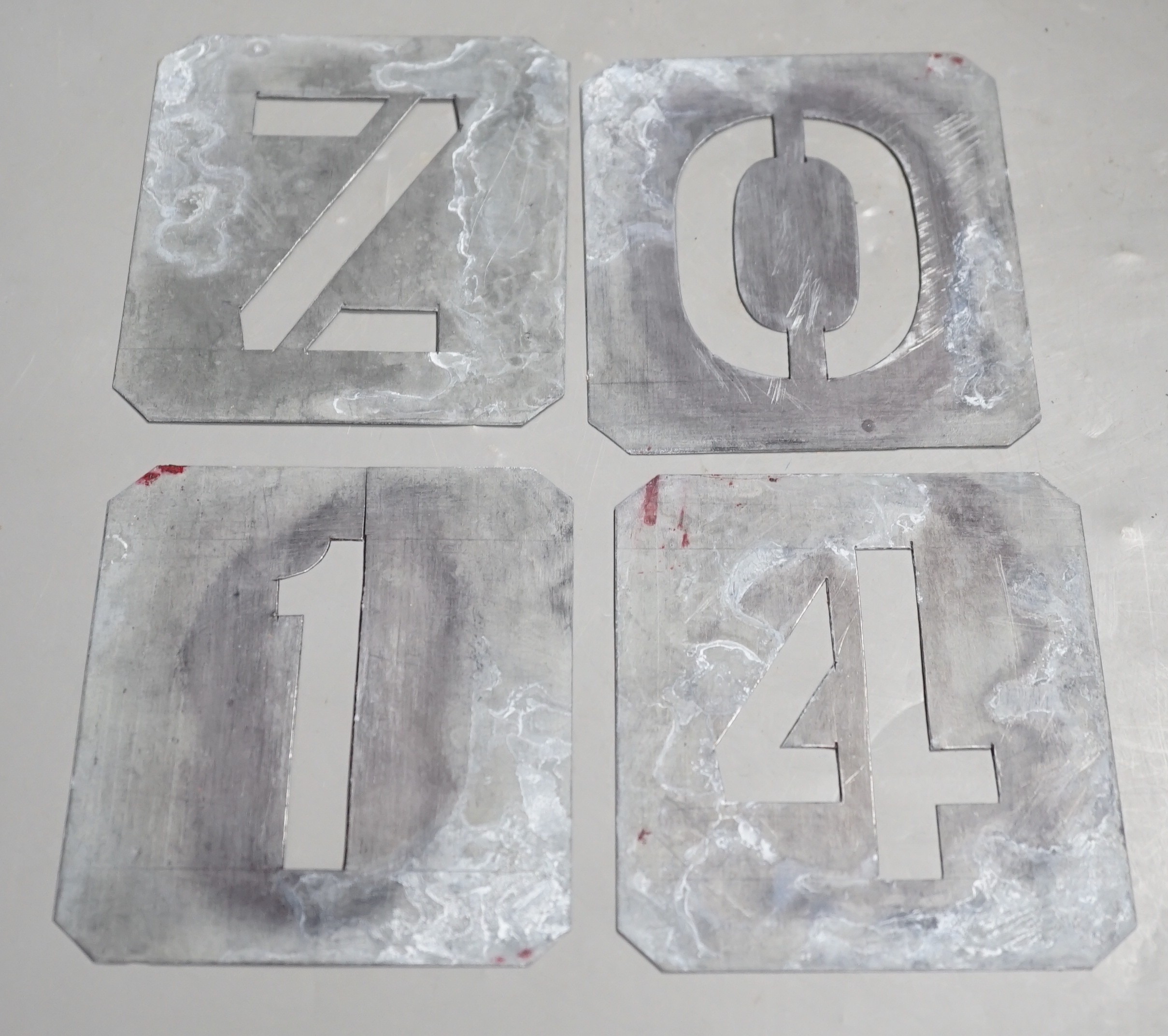 2 complete sets of zinc alphabetic stencils, one other set (C missing), and two part-sets of numerals